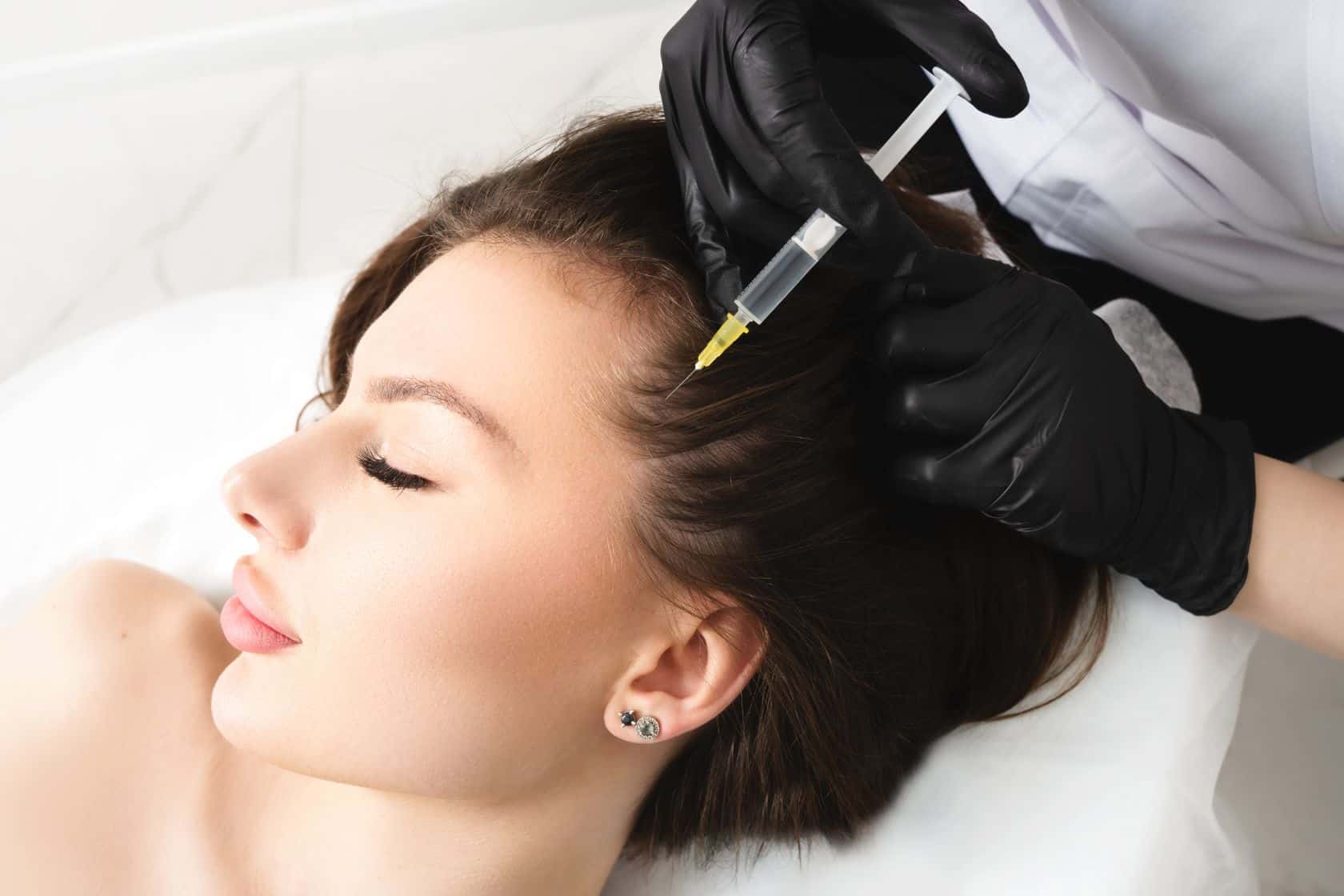 A Female getting injection on her head | Empower Aesthetics & Wellness in Richmond, KY
