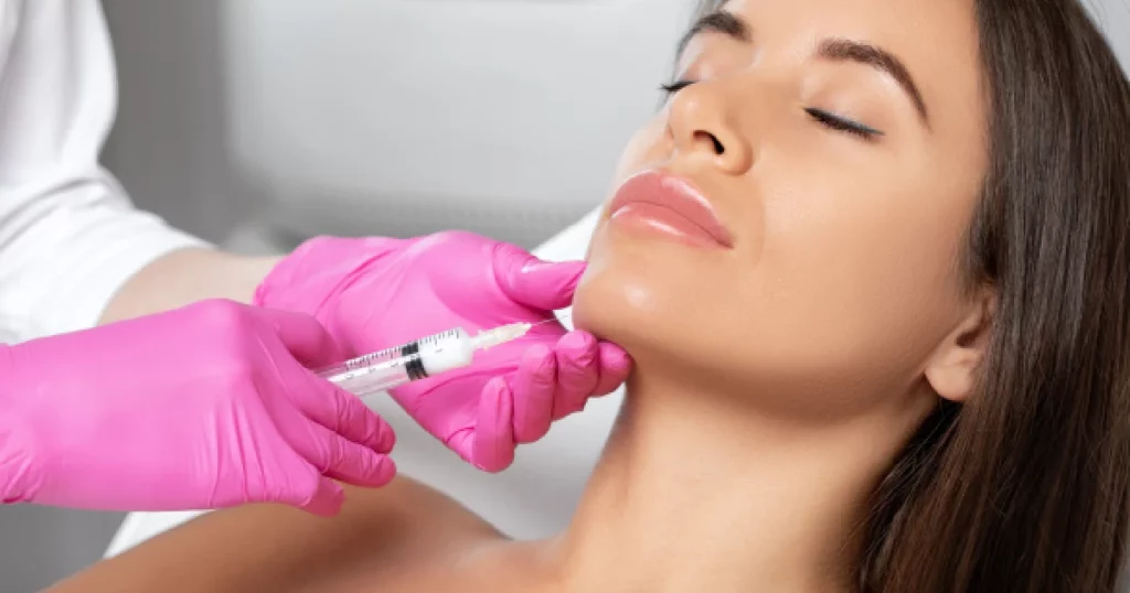 Woman receiving a Kybella injection under the chin in Richmond, KY