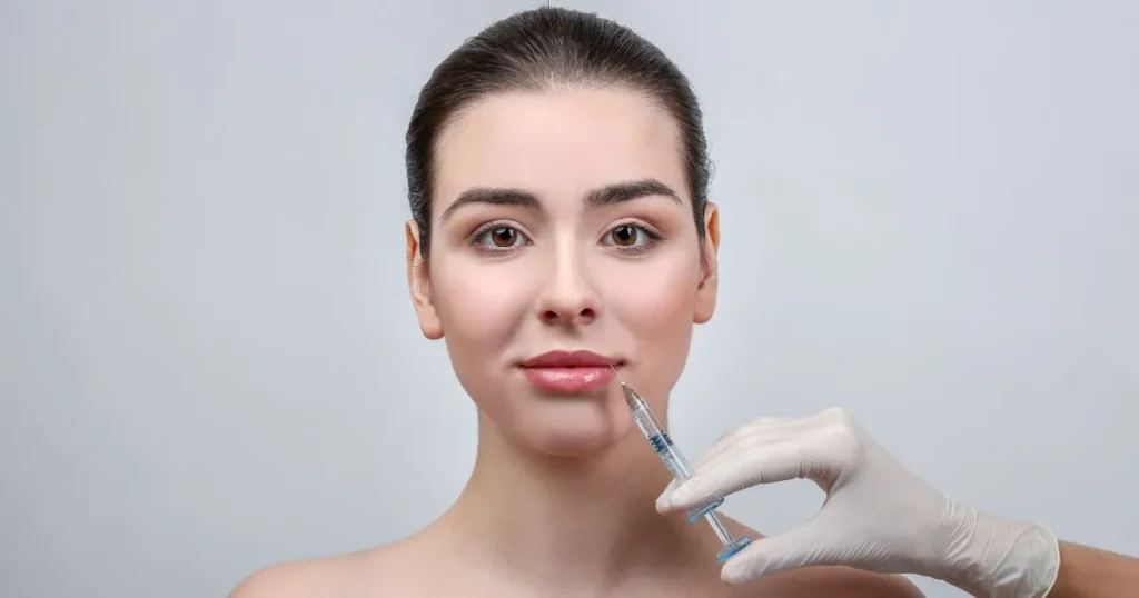 Woman receiving a Dermal Fillers injection in her lips in Richmond, KY